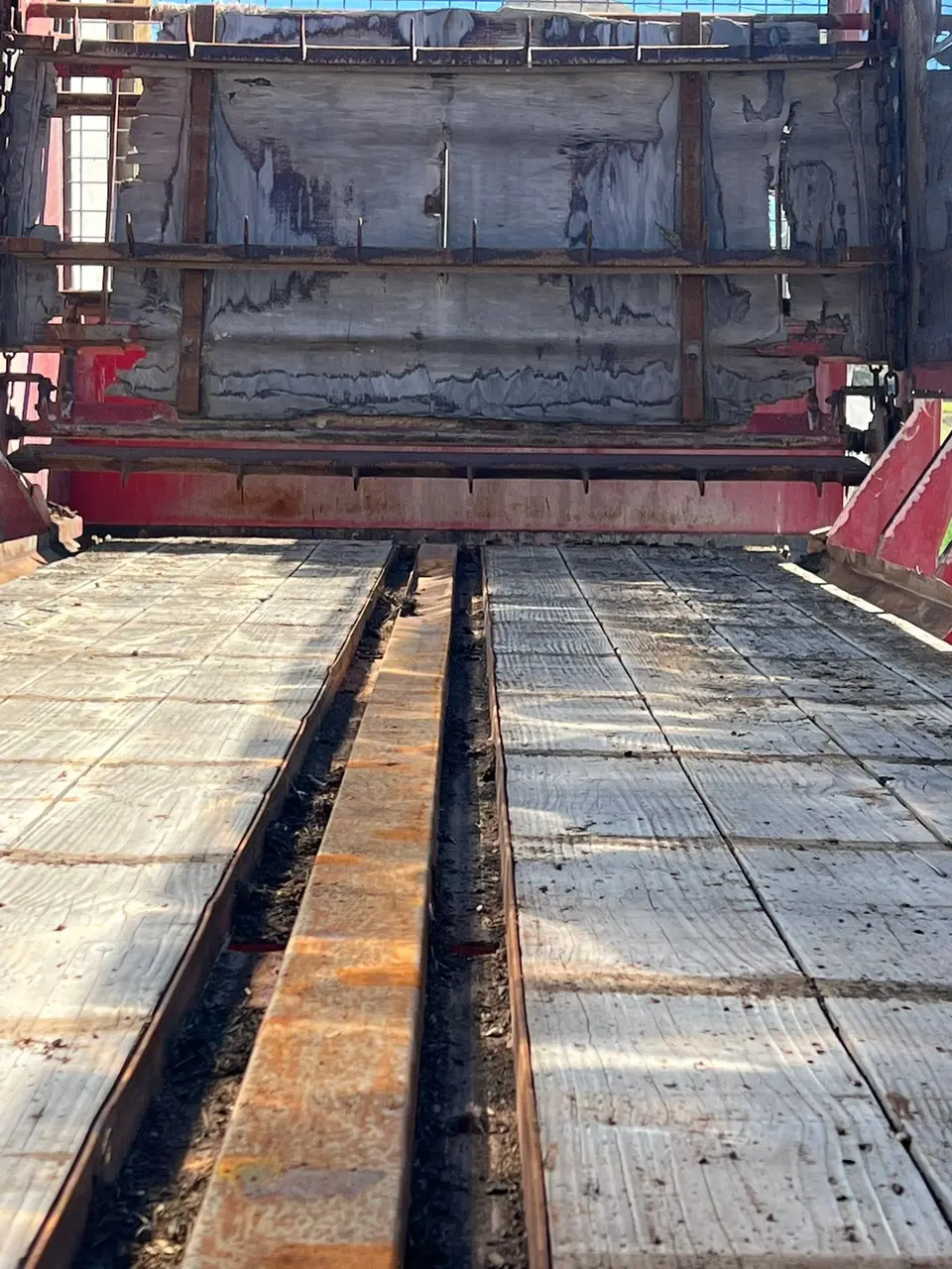 Refurbished centre chain track running down the floor of the silage wagon